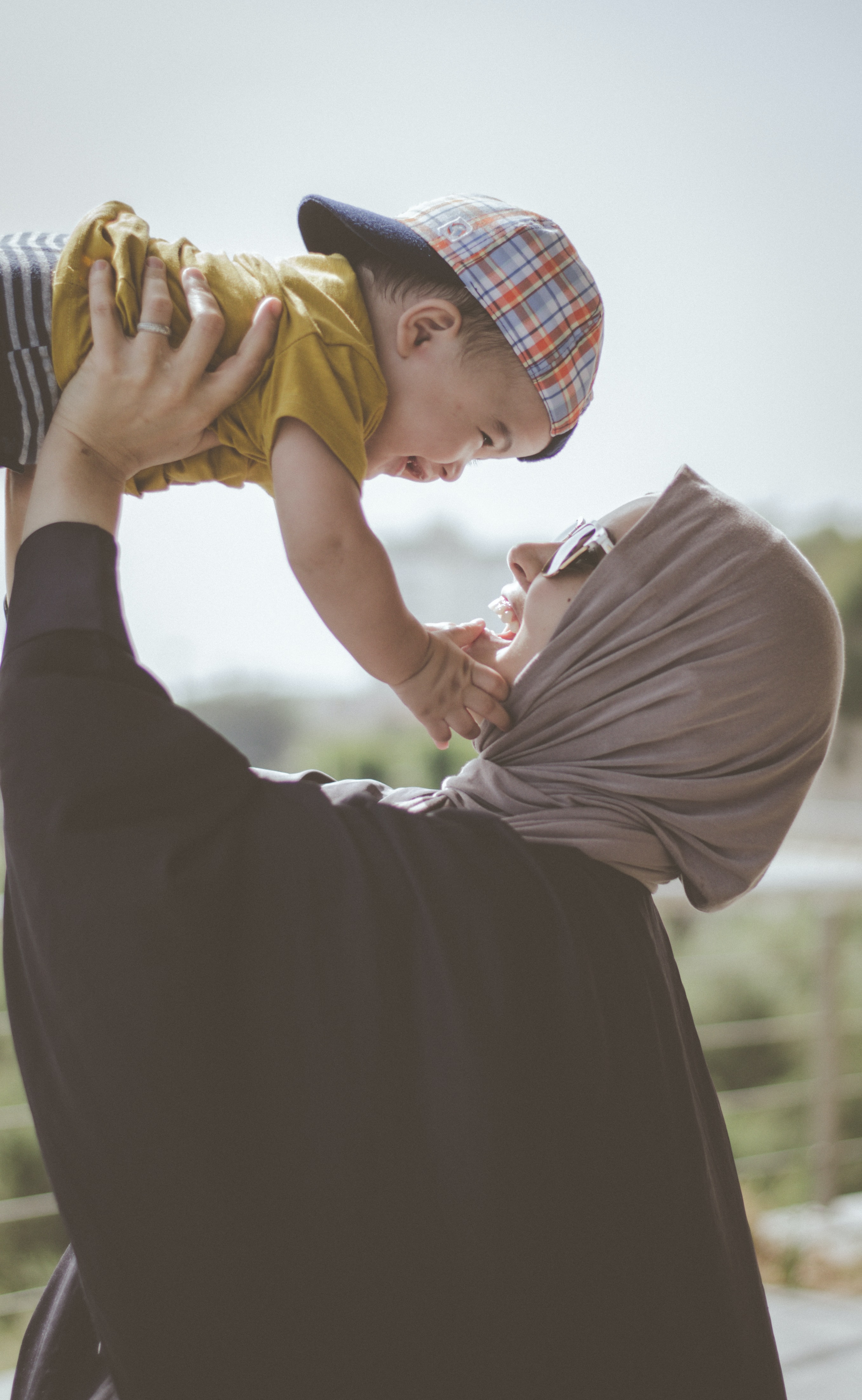 Mother lifting up child